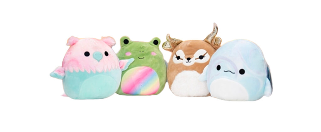 Set of colorful Squishmallows plush toys including owl, frog, deer, and narwhal characters.